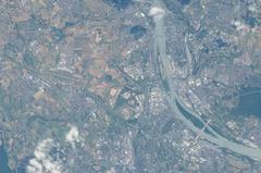 Aerial view of Germany showing Wiesbaden with Salzbachtalbrücke bridge, railway lines and station, the Rhine river, and the city of Mainz