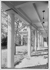 Mr. and Mrs. Edgar B. Stern standing in front of their residence at 11 Garden Ln., New Orleans, Louisiana