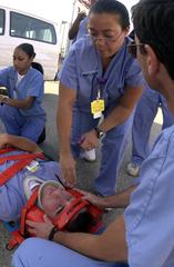 Navy Hospital Corpsmen and Medical Officers assessing a simulated car accident victim at Los Angeles County USC Medical Center