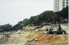 Cleared construction site next to historic LAC+USC hospital building in Los Angeles