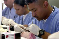 Navy Hospital Corpsmen and Medical Officers training clinical skills at Los Angeles County USC Medical Center