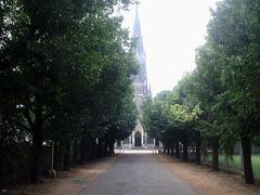 Historic Old Loyola Church with Gothic architecture surrounded by greenery