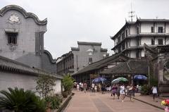 Main street of Luodai ancient town in Sichuan, China with traditional architecture and busy pedestrian activity