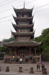 Scenic view of Luodai ancient town with traditional Chinese architecture and mountains in Sichuan, China