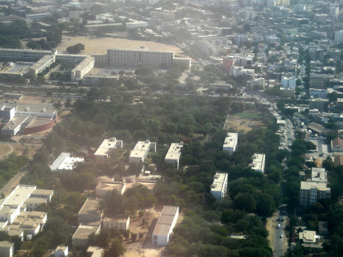 Aerial view of Dakar, Senegal showing the cityscape with Université Cheikh Anta Diop campus on the left