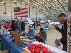 Kids exploring aviation exhibits at Aviation and Maritime STEM Education Expo at Boston Logan Airport