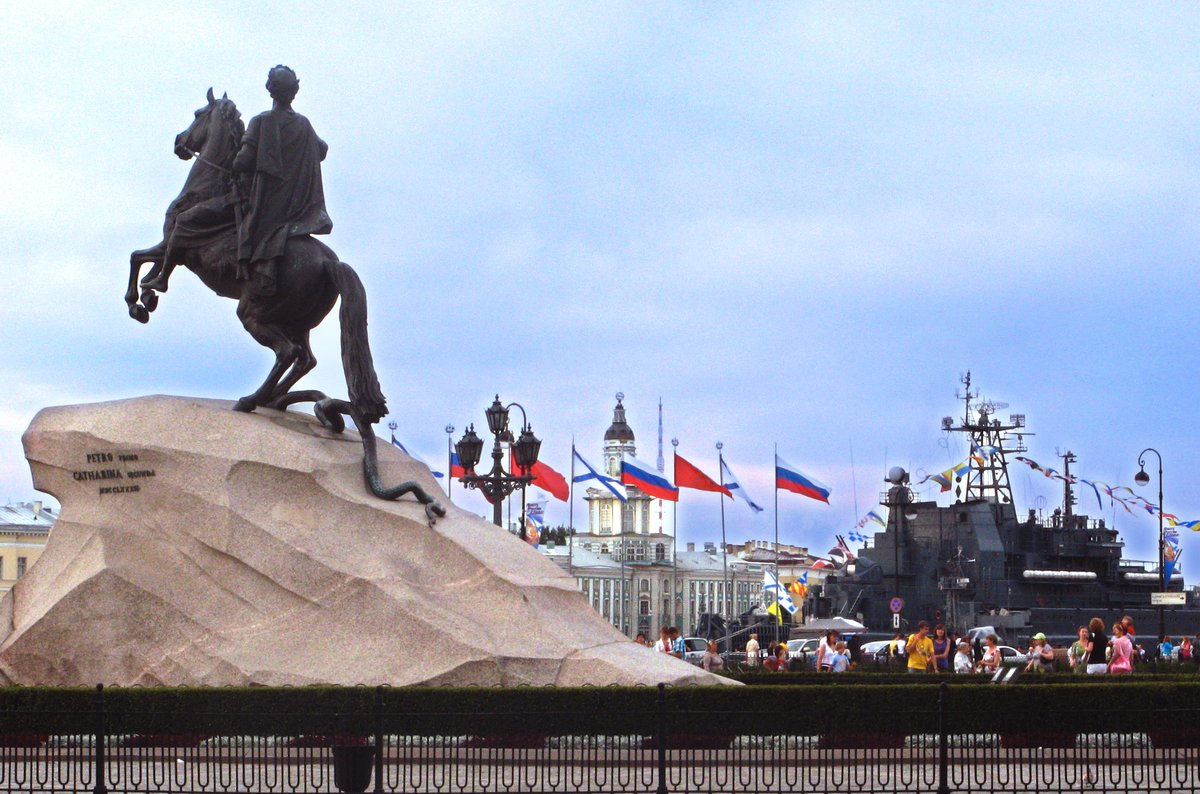 The Bronze Horseman statue, Kunstkamera building, and a warship docked in Saint Petersburg during Day of Navy celebration