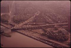 Aerial view of East River Drive in Manhattan with multiple lanes of traffic and surrounding buildings