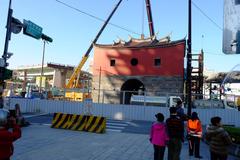 Zhongxiao Bridge Connection Ramp demolition on third day looking north from Baoqing Road and Zhongxiao West Road safety island towards Taipei City North Gate south face