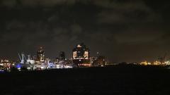 Elbphilharmonie concert hall illuminated at night in Hamburg harbor