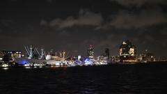 Hamburg harbor at night with illuminated Elbphilharmonie building