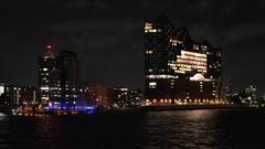 Elbphilharmonie concert hall illuminated at night in Hamburg harbor