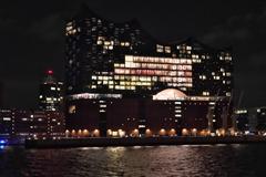 Hamburg harbor at night with illuminated Elbphilharmonie building