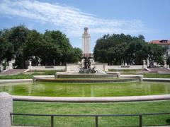 Main building of University of Texas at Austin with a large fountain and green lawns