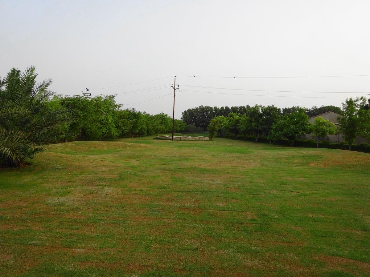 Malir River flowing through Karachi city with urban buildings and greenery