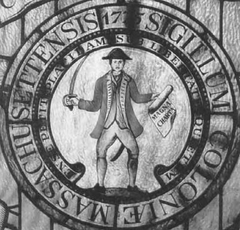 First state seal of Massachusetts from 1775 to 1780 depicting an American patriot holding Magna Carta and a sword symbolizing the fight for liberty