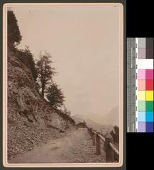 Scenic road view from Serneus towards Klosters with mountain landscape in the background