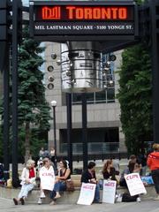 2009 City of Toronto workers strike demonstration at Mel Lastman Square with crowds carrying signs