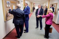 U.S. Secretary of State John Kerry and officials viewing display of U.S. Presidents and Saudi Kings at U.S. Embassy Riyadh