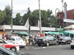 Mexico City Metro Hospital General station entrance with sidewalk vendors