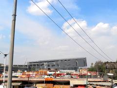 Arena viewed from pedestrian bridge with clear sky