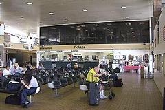 Interior view of Miami Amtrak station showing ticket counters and digital display boards in February 2008