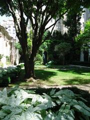 Garden outside the Frick Museum in Manhattan viewed through a gated fence