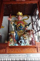 Statue of the northern Vaiśravaṇa holding a pagoda at the Temple of the Six Banyan Trees