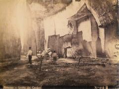 Wilhelm von Gloeden photograph of a cave in Siracusa, titled 'Cave of the rope-makers' in the Latomia dei cordari, dated August 1, 1900