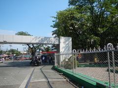 View of Manila North Cemetery at Blumentritt Road Junction with Quezon City Welcome Road sign and Manila North Green Park in Sampaloc, Manila