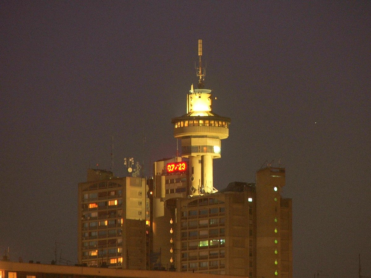 Genex Tower in Belgrade lit up at night