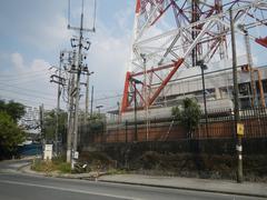 Aerial view of ABS-CBN Broadcasting Center and Eugenio Lopez, Jr. Communications Center with nearby roads and landmarks in Quezon City