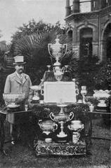 Shanghai horse racing fan with his trophies