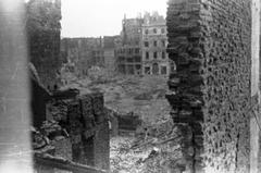 Ruins of townhouses on the corner of Miodowa and Senatorska Streets in Warsaw during the Warsaw Uprising with rubble covering Podwale Street