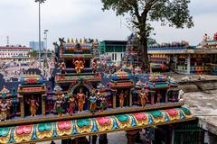 Temple entrance at Batu Caves with colorful Hindu statues and steps