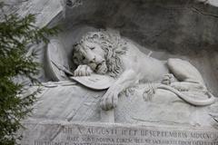 The Lion of Lucerne monument carved into rock face in Lucerne, Switzerland