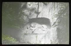 Rock relief of Lion of Lucerne carved in cliff face to commemorate Swiss Guards who died during French Revolution