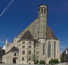 Exterior view of Minoritenkirche Maria Schnee, a historic church with detailed Gothic architecture