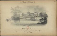 Castle of Biebrich by the calm waters of the Rhine surrounded by wooded landscape