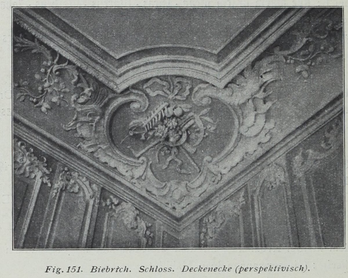 Perspective view of an ornate ceiling corner at Biebrich Palace