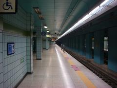Banpo Station platform with escalators and digital display board
