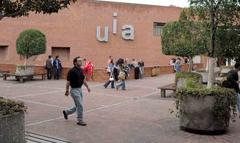 View of Universidad Iberoamericana campus in Mexico City with modern architecture and palm trees