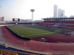 Mokdong Stadium exterior with modern architecture and clear sky