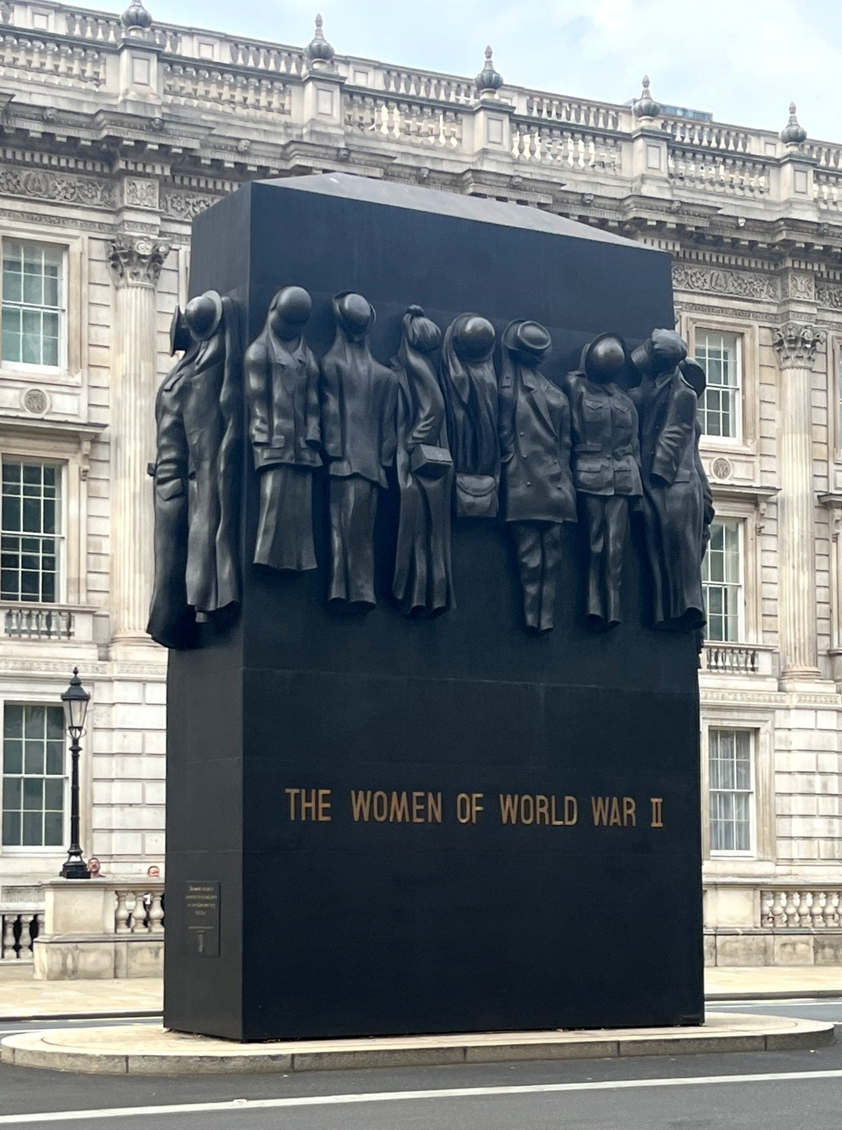 Monument to the Women of World War II in Whitehall London surrounded by buildings