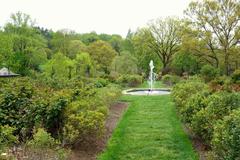 Morris Arboretum entrance with lush green trees and pathway, Chestnut Hill, Philadelphia