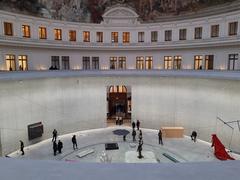 Exhibition at Bourse de Commerce in Paris with visitors viewing displays