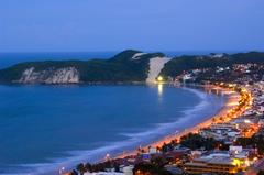 Sunset view of Ponta Negra beach in Natal, Rio Grande do Norte, Brazil with Morro do Careca dune in the background