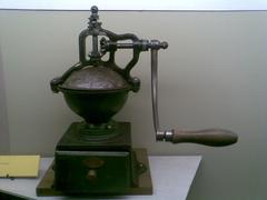 Old French coffee grinder made of wood and metal