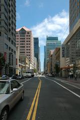 View looking down Mission Street from 3rd Street in San Francisco with city buildings and streets in 2011