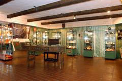 Exhibits inside Duftmuseum Farina Cologne showcasing perfume bottles and historical artifacts